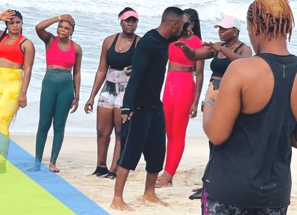 Guests taking part in a daily beach workout