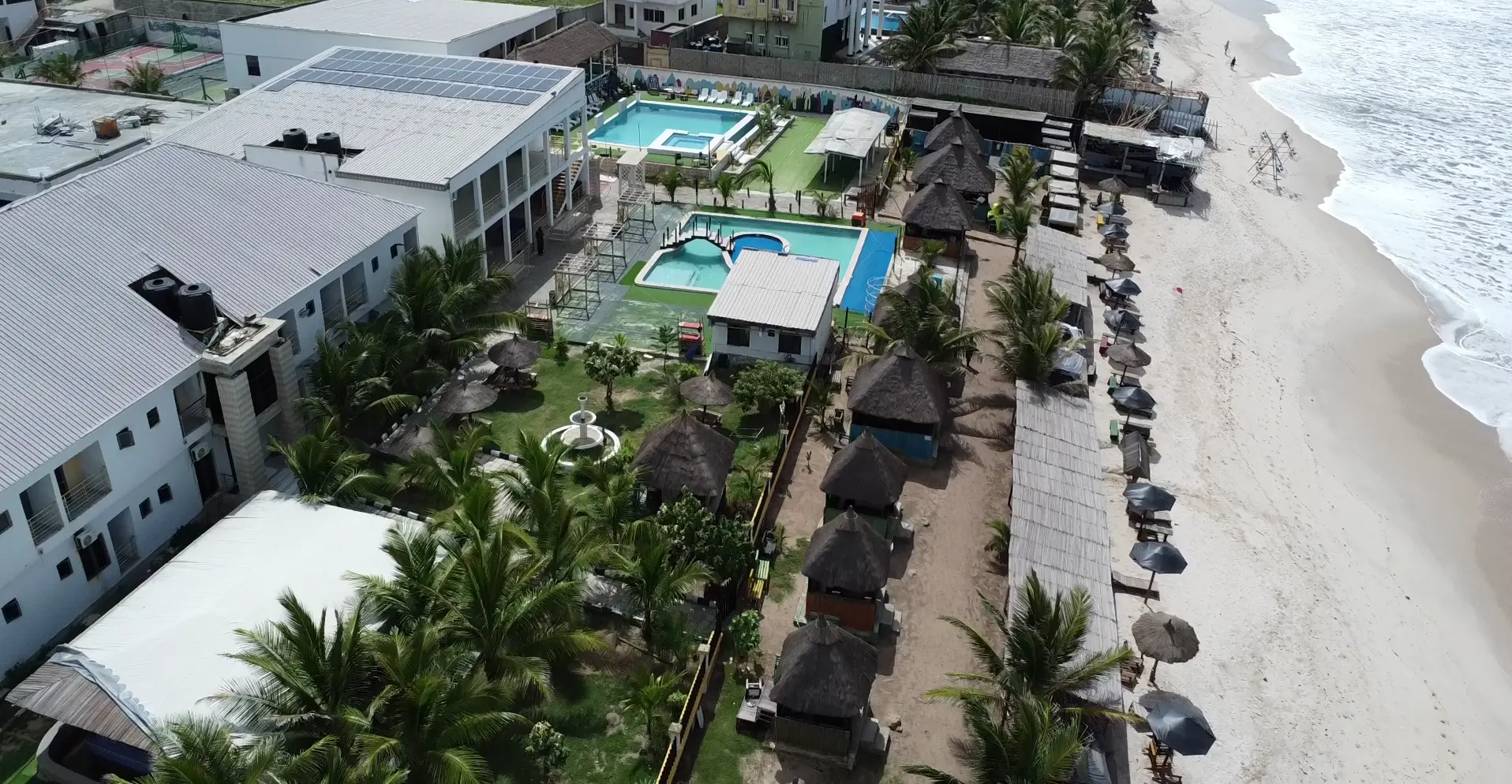Aerial view of the resort pools, cabanas and Atlantic shoreline